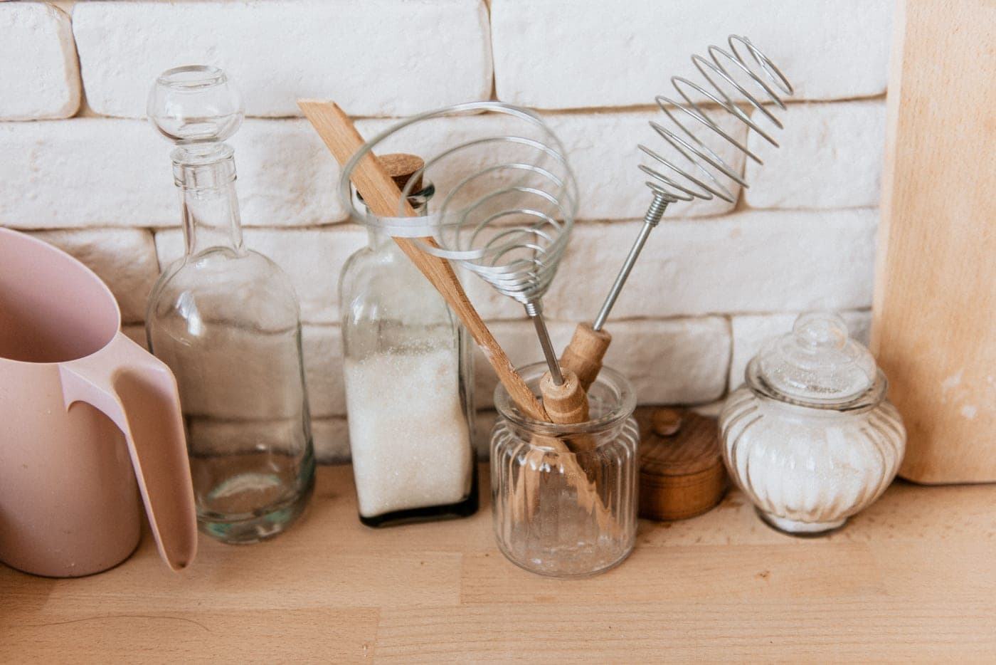 A jar of sourdough starter on a kitchen counter