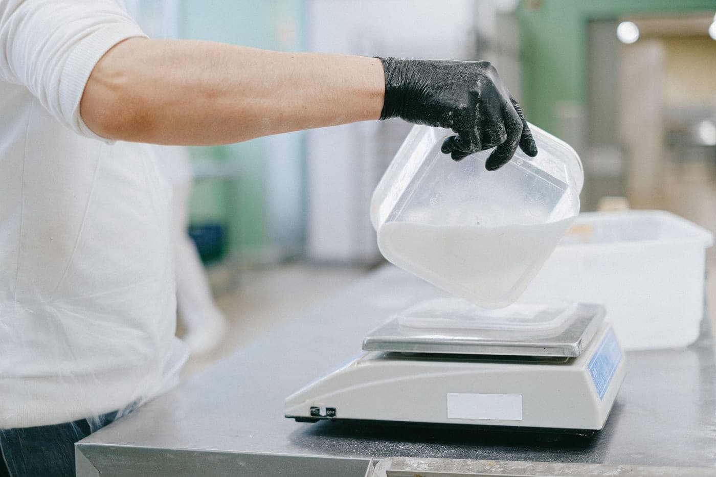 A digital kitchen scale weighing flour